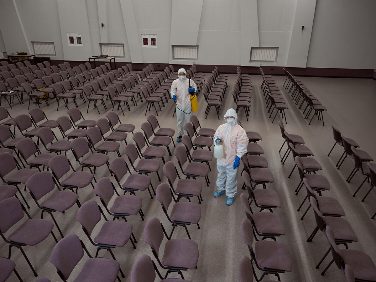 fogging-technicians-treating-large-conference-room-1200x900
